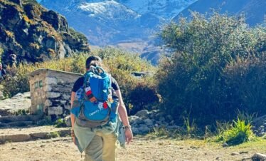 Mt. Ama Dablam view with a tourist enjoying the trek.