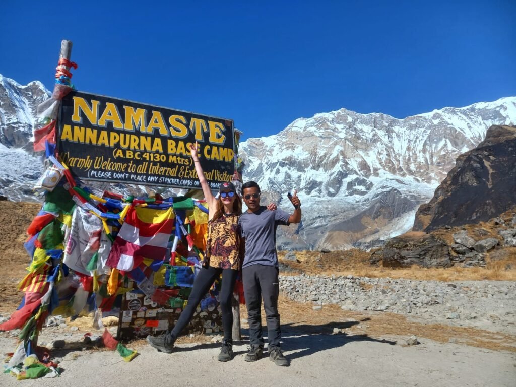 Trekkers at Annapurna Base Camp (4,130m) during the 7 Days Annapurna Base Camp Trek, surrounded by stunning Himalayan peaks.