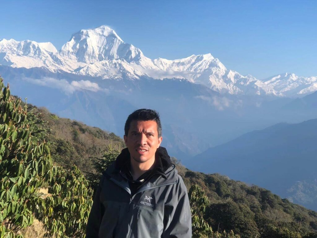 Traveler with Dhaulagiri Mountain in the background from Poon Hill, Nepal