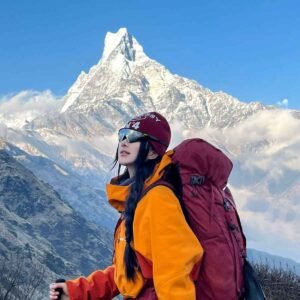 Mardi Himal Trek Nepal with Machhapuchhre view female trekker on scenic ridge trail near High Camp
