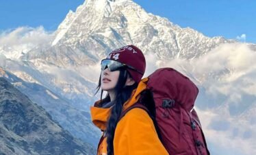 Mardi Himal Trek Nepal with Machhapuchhre view female trekker on scenic ridge trail near High Camp