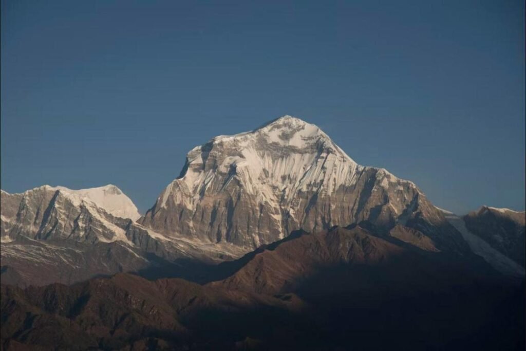 Everest Scenic Flight passenger view of a snow peak set against a deep blue Himalayan sky